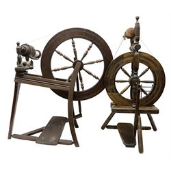 Two vintage beech spinning wheels, largest example H92cm