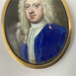 In the manner of Christian Zincke (German 1683-1767)
Portrait miniature upon enamel, circa 1750
Head and shoulder portrait of a gentleman in blue coat, possibly George II 
Within 9ct gold frame with ivory panel verso
Oval 4.5cm x 3.5cm

This item has been registered for sale under Section 10 of the APHA Ivory Act