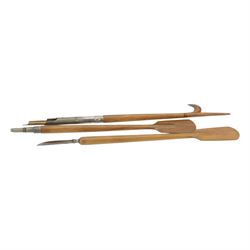 Novelty desk inkwell formed as a boat, with central chimney opening to reveal a metal inkwell with two pens formed as oars, together with another inkwell in the from of a bull dog 