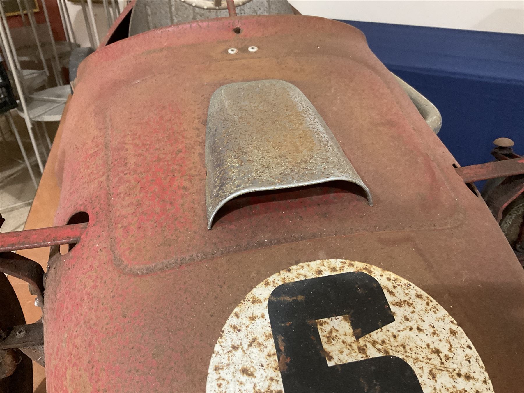 Tri-ang pressed steel Grand Prix Vanwall child’s pedal racing car, English 1960s, finished in red with racing No.3, original white plastic steering wheel, metal bucket seat, bonnet air intake, chrome plated side exhaust, chrome spoked wheels with chrome plated spinners, black solid rubber tyres L121cm W53cm H46cm)