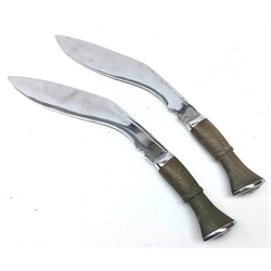  Pair of Kukri knives, 28.5cm chromed shaped blades, green stained shaped grips with chrome lozenge shaped pommels, L41cm (2)   