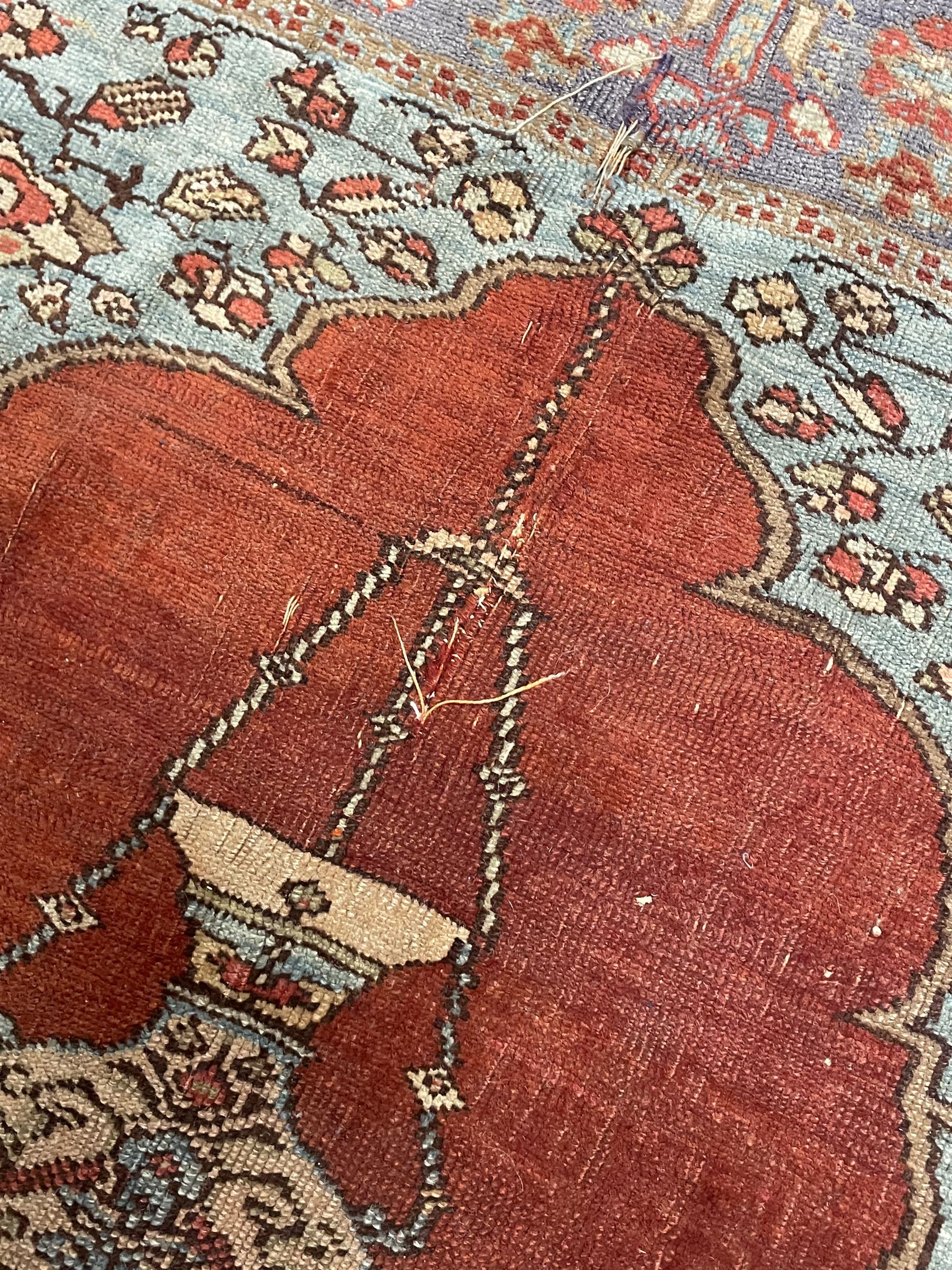 Persian red ground prayer rug, decorated with stylised flowers (201cm x 143cm), and a small Persian design triple medallion rug (142cm x 68cm)