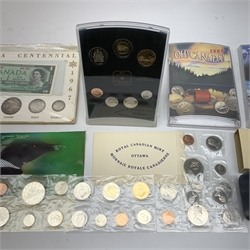 Commemorative Canadian coins and coin sets including five cased one dollar coins, 1972 coin set in presentation folder, various modern year sets in plastic cases etc