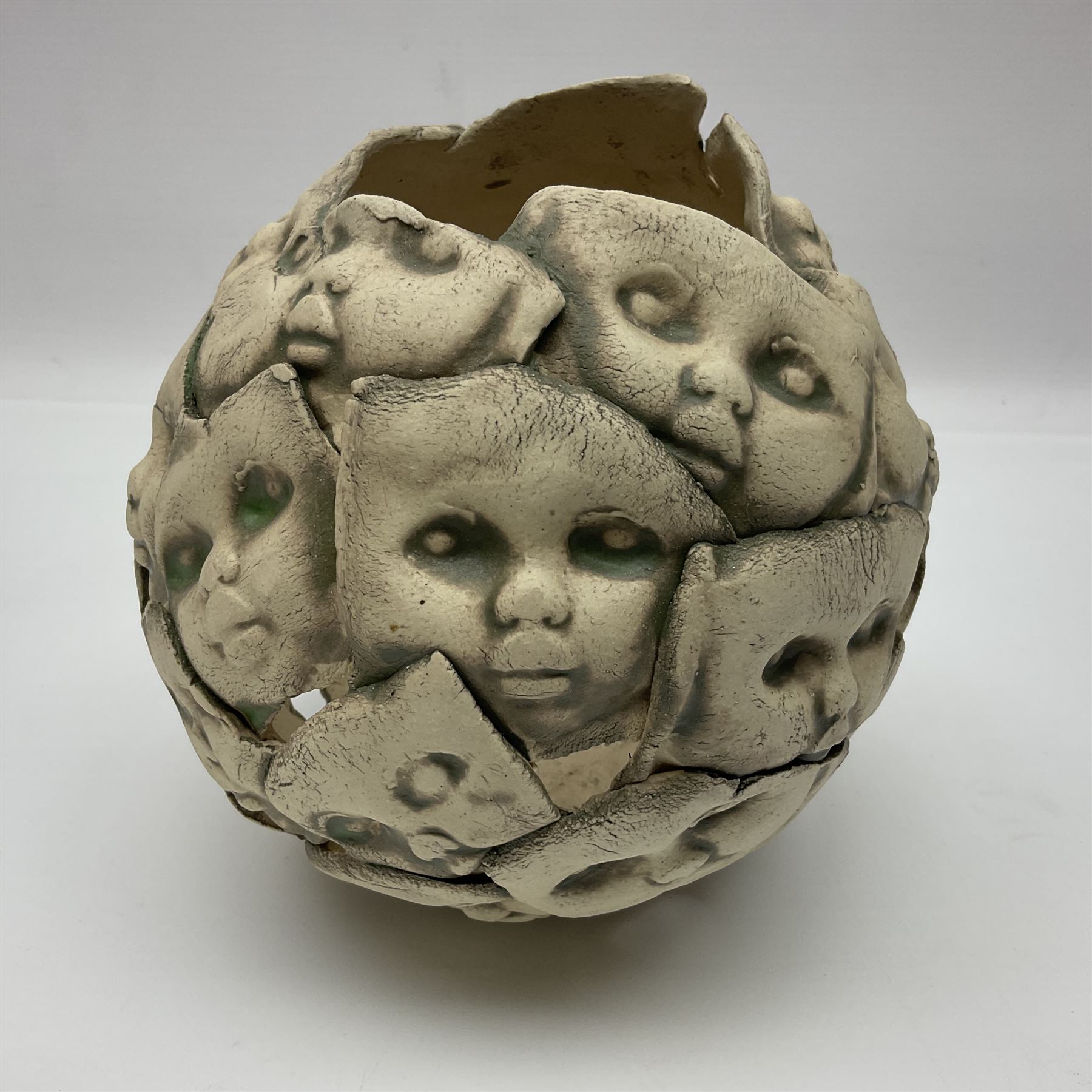 Studio pottery bowl, decorated with faces and a green glaze finish, H18cm 