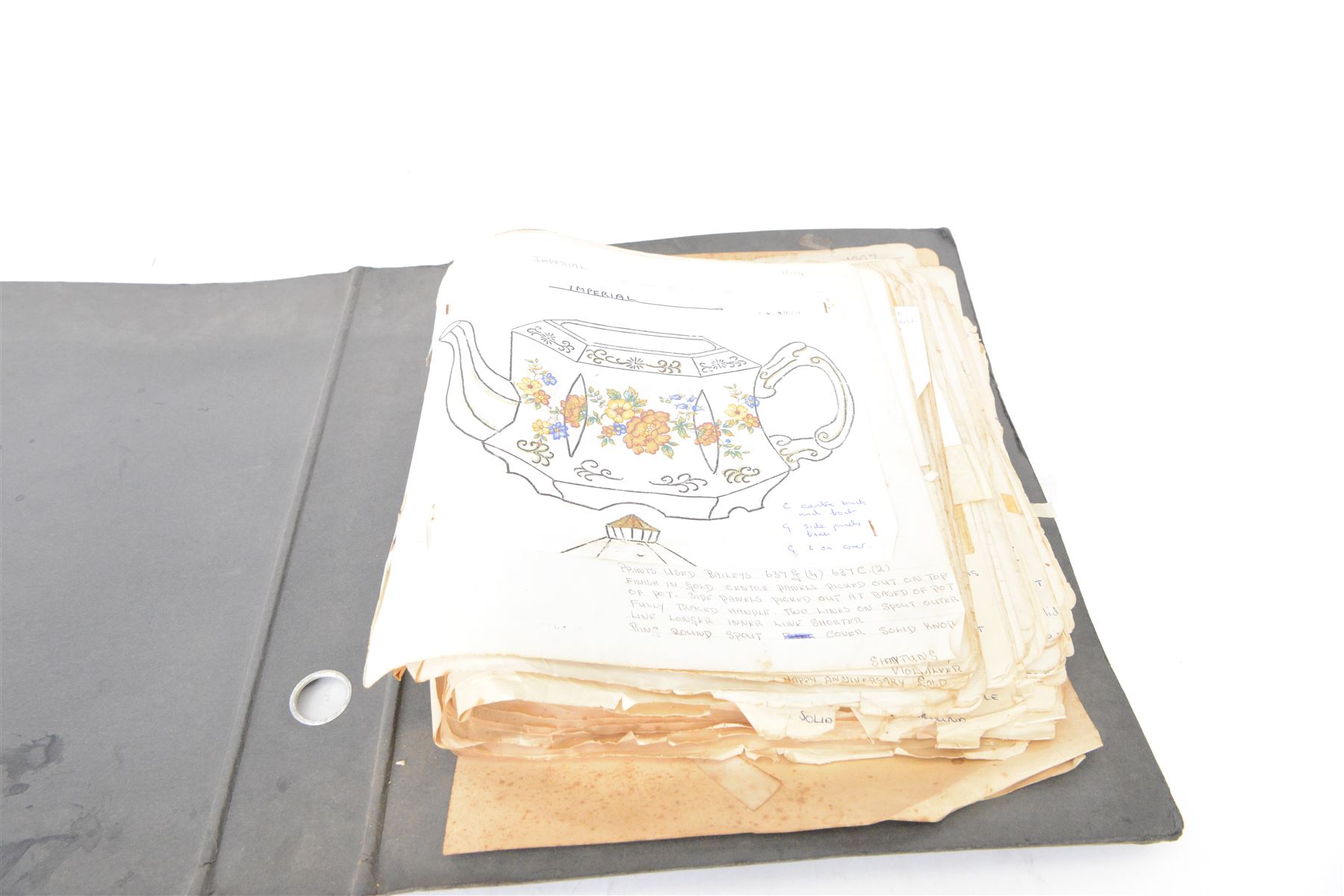 Wood & Sons Ltd Burslem pattern book, late 20th century, designs in colour and black and white, all mounted onto square leaves, leaves annotated with decorating notes, some cancellations noted boldly over the design, collected as one in a ring binder, factory labels to upper-cover, folio 44.5 x 36cm