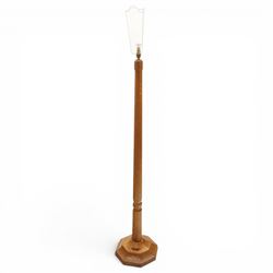 Mouseman - oak standard lamp, the turned octagonal column terminating to a stepped cavetto...