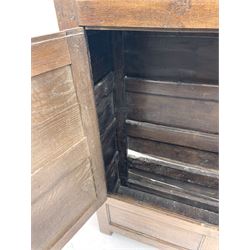 18th century and later oak livery cupboard, enclosed by two fielded panel doors with iron hinges, panelled sides and boarded back, stile supports
