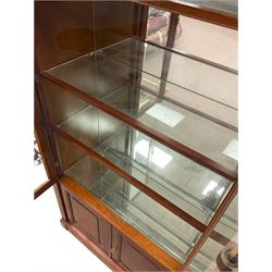 Grange Furniture - cherry wood finish display cabinet, two bevel glazed doors enclosing mirrored interior with glass shelves, double panelled cupboard below, on plinth base