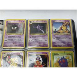 Collection of Pokemon trading cards, mostly 1999 Wizards Pokemon cards to include holo Charizard 4/102, first edition holo Machamp 8/102, further holographic cards; Dark Flareon 35/82 and Dark Vaporeon 45/82, cards from themed sets and 4th edition prints; 1998 Electronic Pokédex with cardboard boxes for themed decks Blackout, Overgrowth and Power Reserve Jungle, along with a large quantity of energy and trainer cards 
