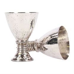 Pair of 20th century Greek silver metal goblets, each with planished tapering bowl upon a knopped stem and stepped spreading foot, marked Lalaounis 925, H10.5cm
