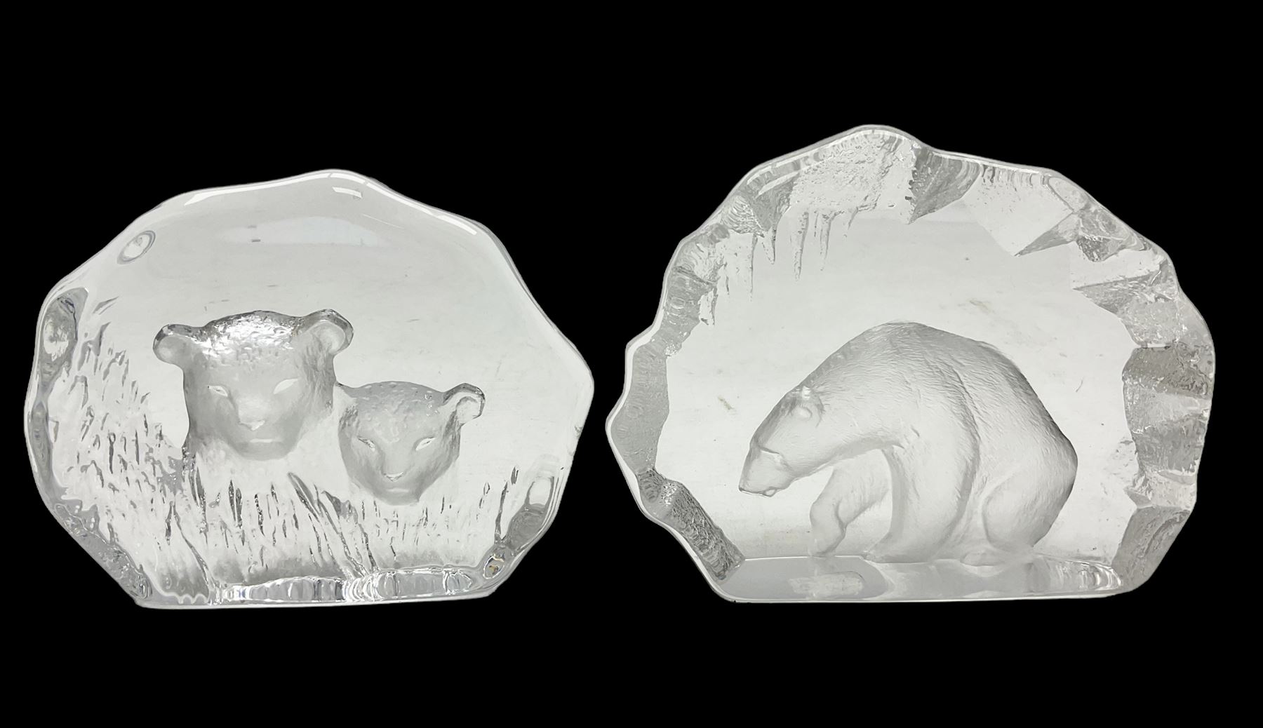 Two Mats Jonasson, Sweden paperweights, comprising polar bear in ice cave no 3152 and lion cubs, both with etched marks beneath, tallest H11.5cm