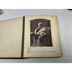 Victorian photograph album with ornately gilded and hand painted covers and brass clasp, partially stocked with Victorian and later portraits etc; another well stocked Victorian leather bound photograph album relating to the Cawood family; three other Victorian leather bound photograph albums; and small quantity of stereoscopic cards