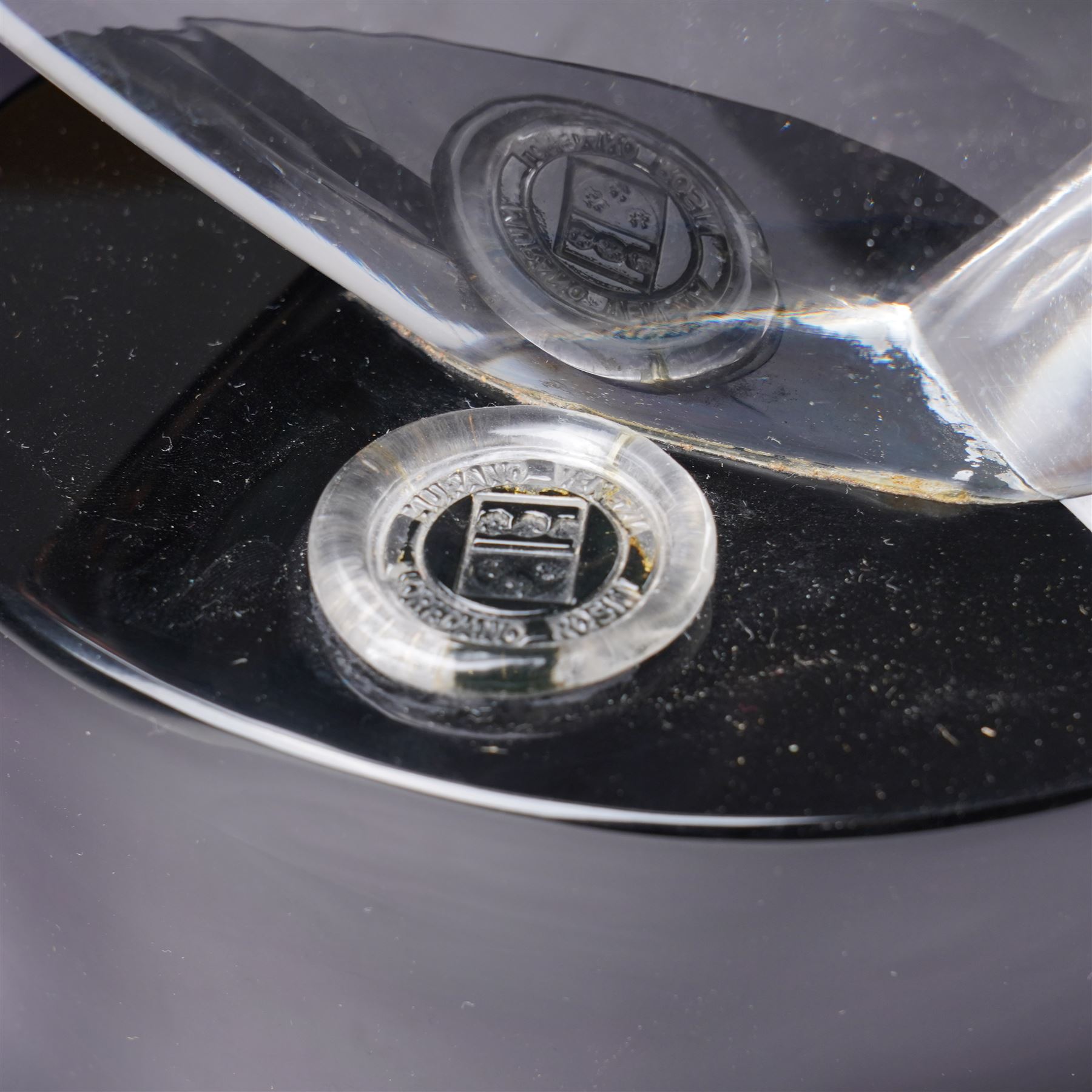 Loredano Rosin (Italian 1936-1992): Horse's Head, clear cut glass sculpture mounted on an oval plinth of black glass with incised signature, with impressed makers medallion, overall H35cm W47cm 
Notes: Rosin was widely exhibited Murano glassmaker who collaborated with artists such as Picasso and Chagall, this piece probably dates from the 1960s. 