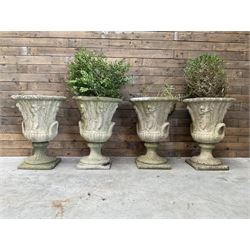 Set of four Victorian design cast stone Grecian urns, tapering form cast with figures and ...