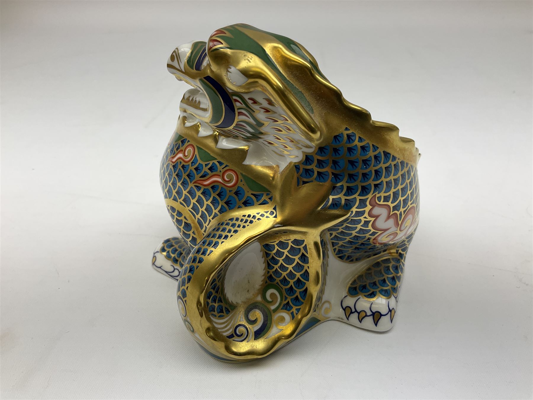 Two Royal Crown Derby paperweights, Dragon of Happiness, limited edition 1227/1500 and Dragon of Good Fortune, limited edition 1227/1500, both with gold stopper, hardwood base, certificate and with printed mark beneath