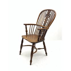 Early 19th century elm and yew wood double hoop Windsor armchair, high stick and pierced splat back, turned supports joined by crinoline and swell-turned stretchers
