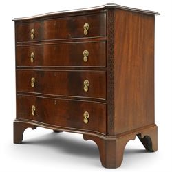Quality Georgian design mahogany serpentine secretaire chest, the shaped top with moulded edge, fitted with cock-beaded secretaire drawer with button-release fall-front enclosing fitted interior, over three graduating drawers with brass drop handles on pierced circular plates, the canted uprights carved with blind-fret strapwork, lower moulded edge on shaped bracket feet