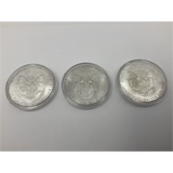 Five United States of America 1oz fine silver one dollar coins, dated 1986, 1987, 1988, 1989 and 1990