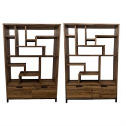 Pair of contemporary oak effect bookcases, each with asymmetric open shelving and double d...
