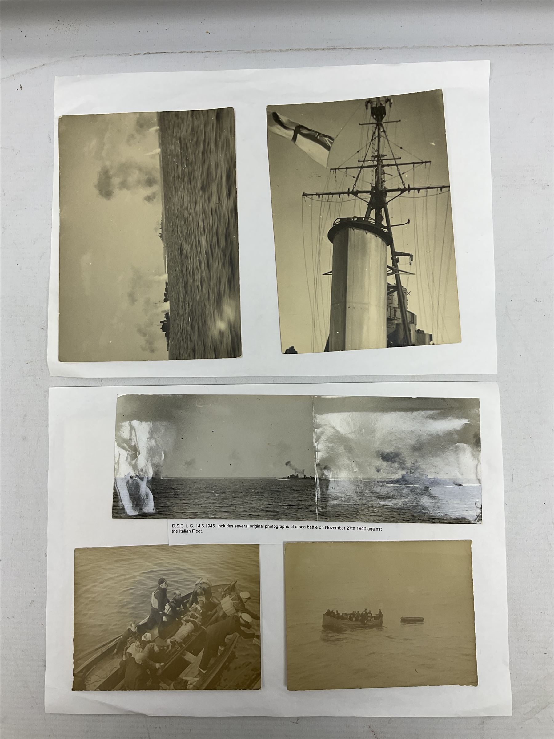 WW2 Royal Naval group of eight medals comprising OBE, hallmarked silver Distinguished Service Cross inscribed verso Lieut. J.R. McCluskie RNVR 1945, 1939-1945 Star, Atlantic Star, Africa Star, 1939-1945 War Medal, Defence Medal and Royal Naval Patrol Service Medal inscribed Lieutenant J.R. McCluskie Royal Naval Patrol Service; with seven original photographs of a sea battle 27th November 1940 against the Italian Fleet and another photographic postcard of Sir Stafford Cripps arriving on board one of the vessels.