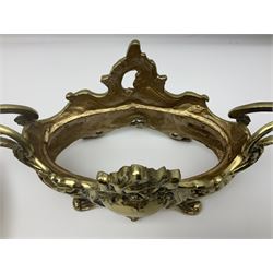 Ornate brass centrepiece, with twin handled vase upon a mirrored base, with floral and scrolling decoration, H23cm 