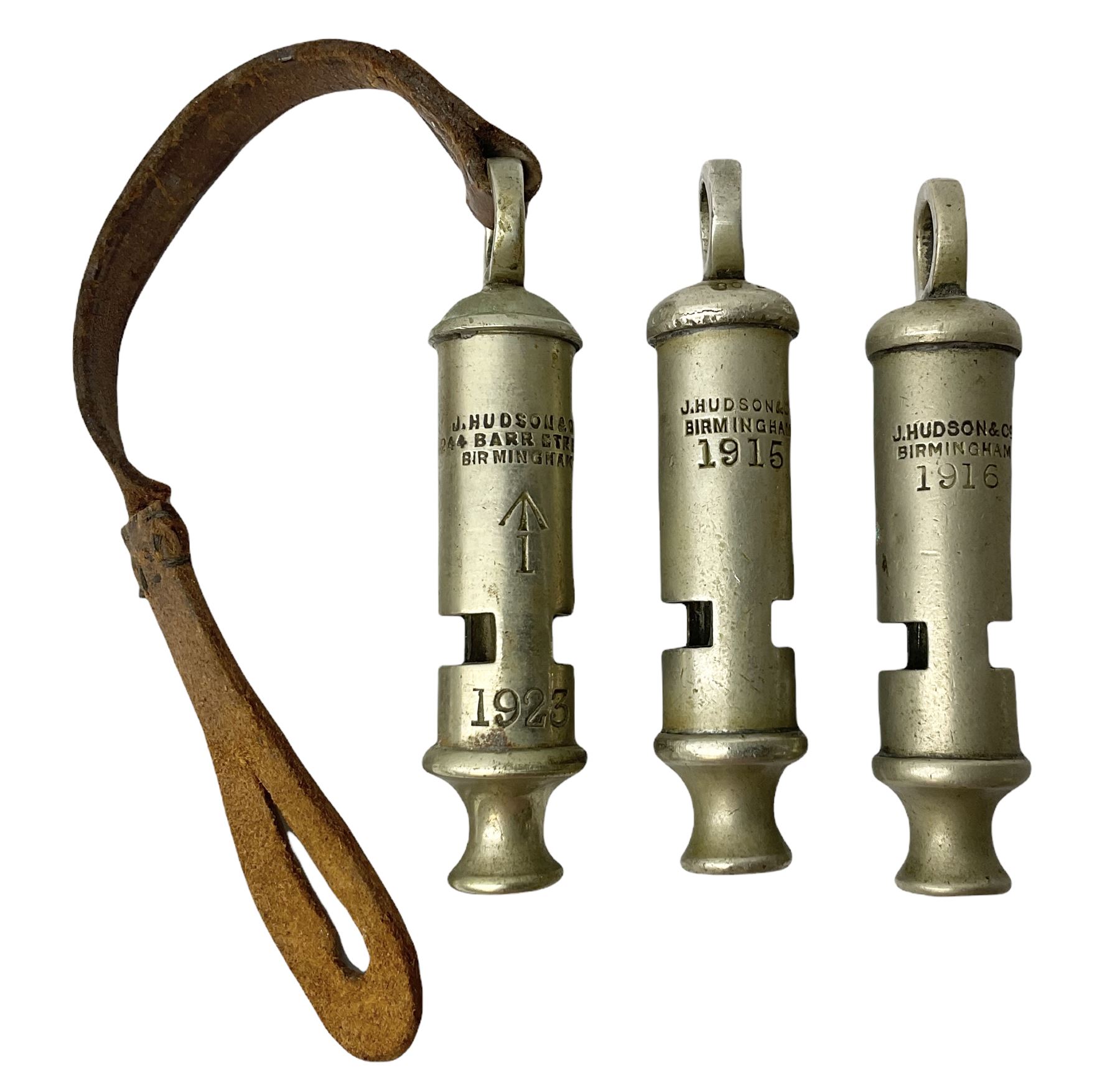 Three J Hudson & Co Birmingham military whistles, dated 1915, 1916, 1923