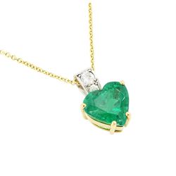 18ct and platinum emerald and diamond pendant necklace, the single heart cut emerald of 3.48 carat, the bail set with two old cut diamonds, London 2019, on an 18ct gold trace link chain necklace, with Alan Poultney Gems report, the emerald with The Gem & Pearl Laboratory report