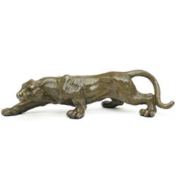 Bronze modelled as a cougar in a crouching pose, signed Milo and with foundry mark, L40cm