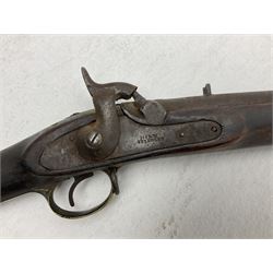 20th century Indian percussion musket, the 76cm barrel with two bands, indistinctly inscribed lock-plate, walnut full stock stamped 642 with brass butt and trigger guard and under barrel ramrod channel L121cm overall