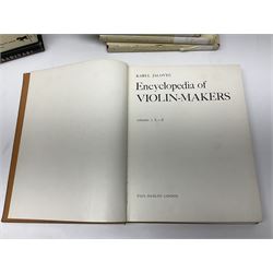 Fourteen books on violins and violin makers including Henley William: Universal Dictionary of Violin and Bow Makers. Five volumes. 1959/60. All first editions with dustjackets; Jalovec Karel: Encyclopaedia of Violin Makers. Two volumes. 1968. Vol.1 with d/j; Heron-Allen Ed.: Violin making As It Was, And Is. Two copies 1984 & 1991. Both with d/j; Henley W.: Antonio Stradivari. 1961; Fetis F.J.: Anthony Stradivari Celebrated Violin Maker. 1964 facsimile edition; Boyden David D.: catalogue of the Hill Collection of Musical Instruments in the Ashmolean Museum. 1979; and two others (14)