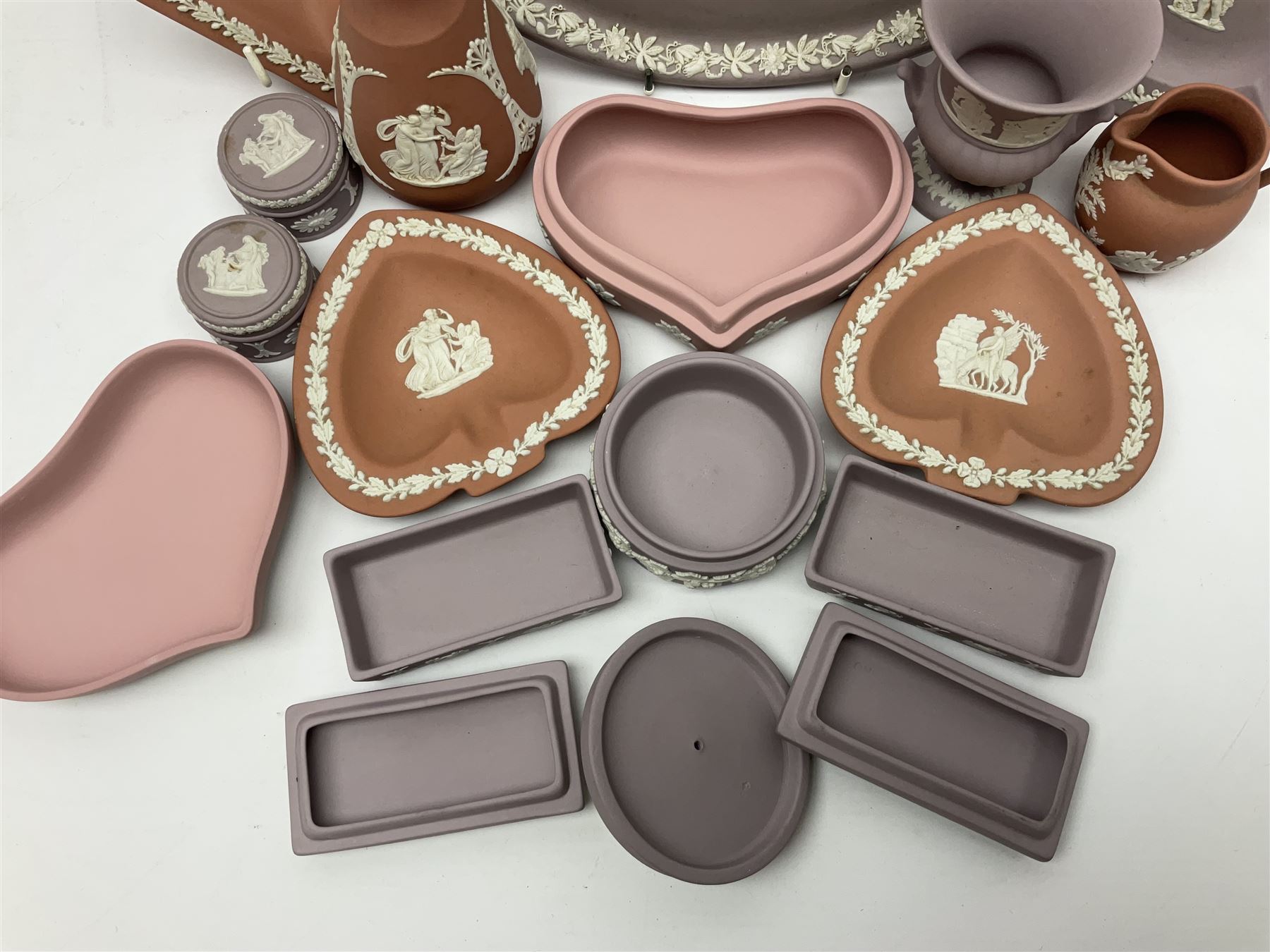 Collection of Wedgwood Jasperware, in orange, lilac and pink colourways, including oval tray, small jug, trinket boxes, trinket dishes, etc , all with impressed mark beneath