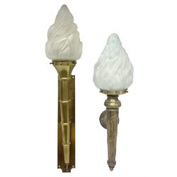 Two 20th century brass wall lights of torch form, with opaque moulded glass flame shades, largest L67cm