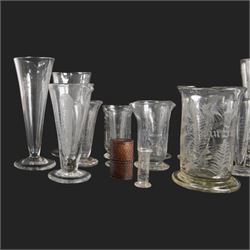 Nineteen apothecary chemists glass measures, of various shapes and age 