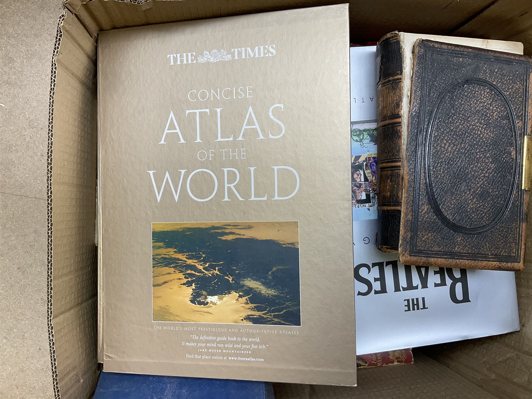 Quantity of books to include The Beatles Anthology hardback, published 2000, leather effect bound The British Empire volumes, The Times Atlas of the World, and other books to include the Bible etc