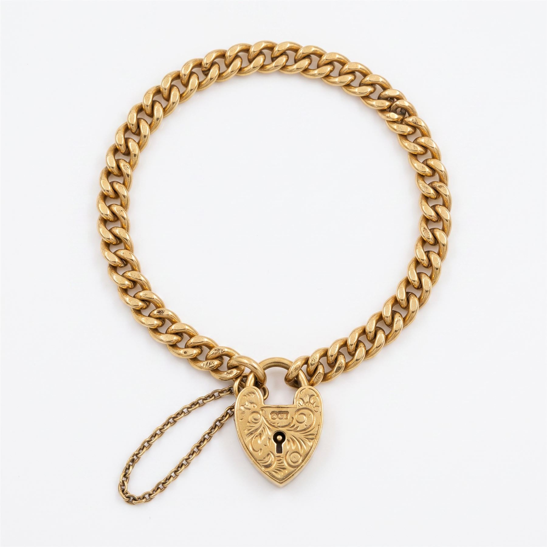 9ct gold curb link bracelet, with engraved heart locket clasp, London 1957, each link stamped 9.375