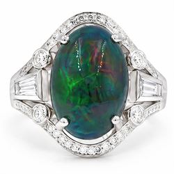 Platinum black opal and diamond ring, four claw set with a single oval cabochon opal of ap...