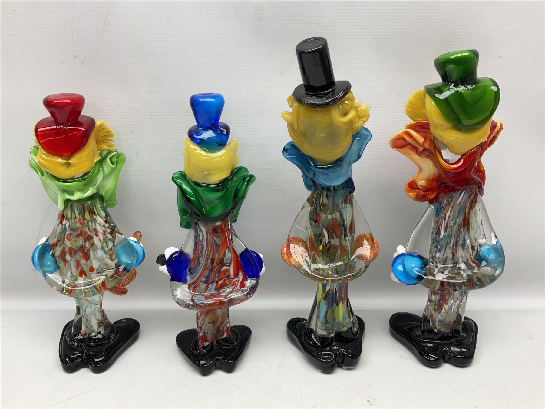 Large quantity of Murano glass clowns, to include larger examples, in two boxes