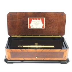 Reuge Sainte-Croix- 21st century Swiss musical box with a highly polished lacquered finish, inlaid and ebonised case with a glazed internal viewing lid, polished steel 144 teeth two-part comb playing three arias from The Phantom of the Opera by Lloyd Webber, with tune indicator and tune sheet.