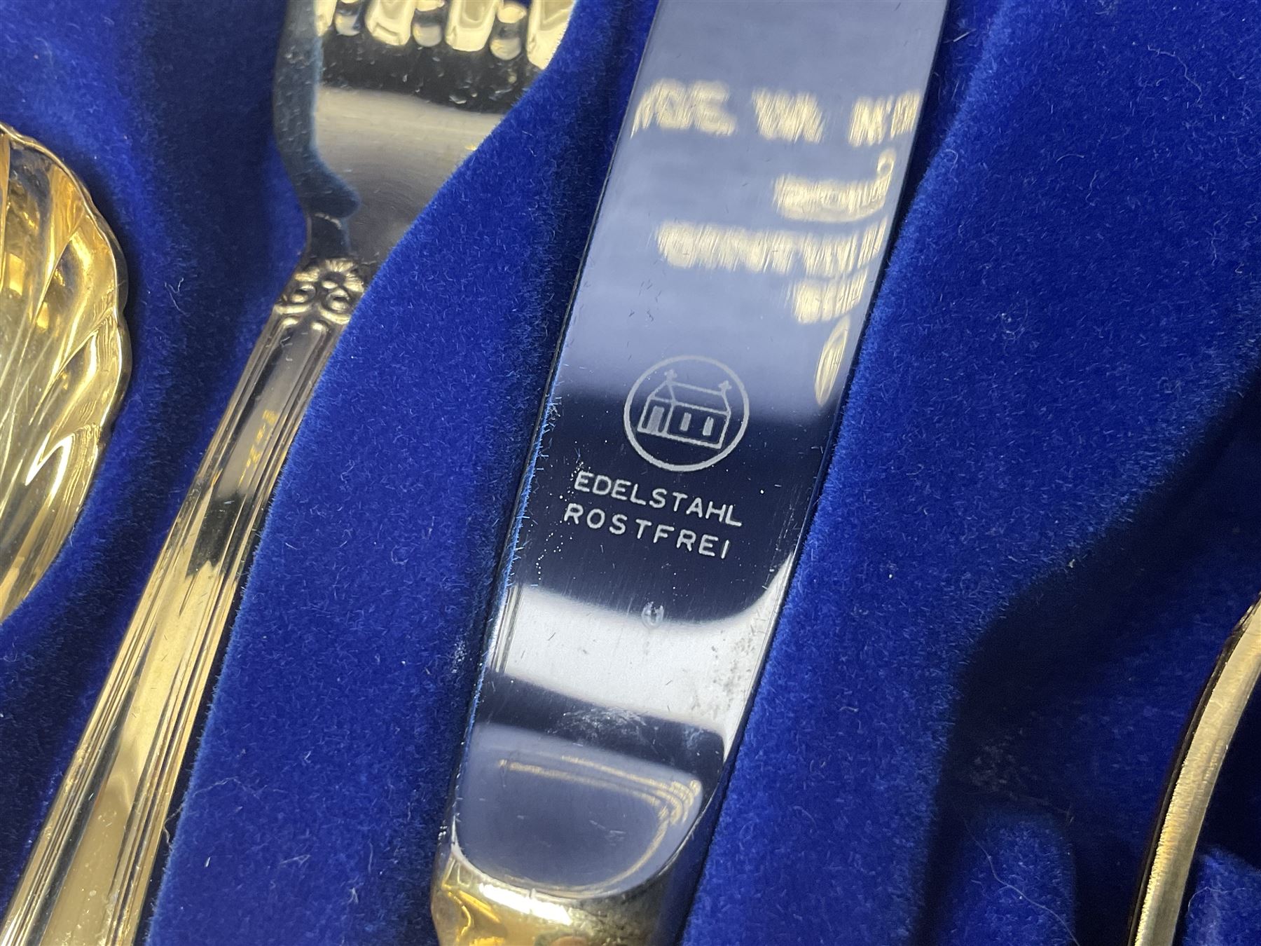 Bestecke Solingen canteen of gold plated cutlery for twelve place settings, including ladle, cake slice, fish servers, fish knives and forks, 108 pieces total, contained within a briefcase 