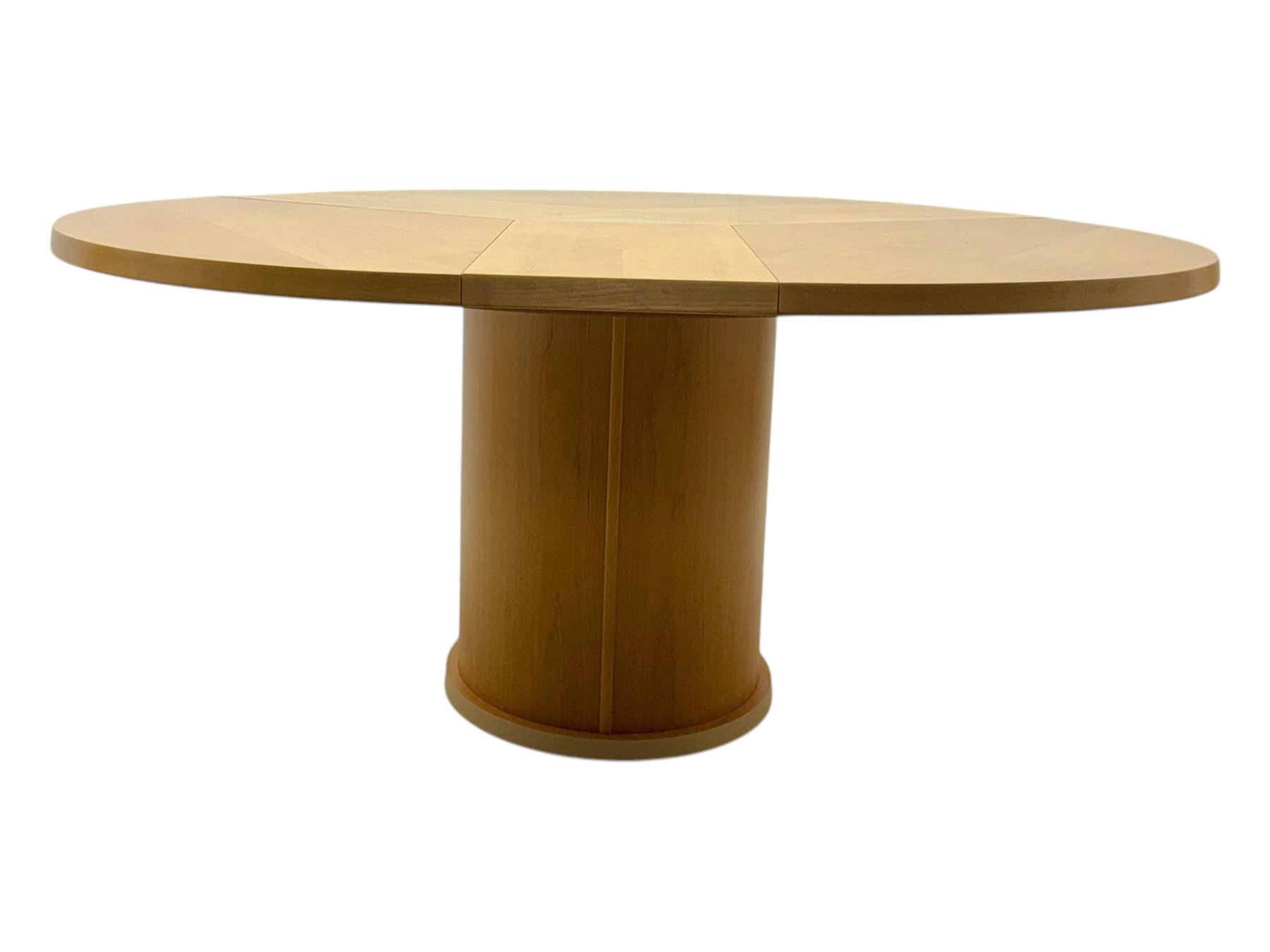Skovby - 'SM32' late 20th century beech circular extending dining table circular segmented top turning to activate a patented spring loaded triple leaf extension stored within the cylindrical column base (Extended diameter 146cm); and set of four chairs (Width 47cm, Depth 56cm, Height 95cm, Seat height 47cm)