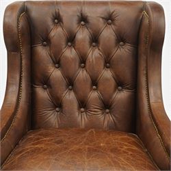 Timothy Oulton - pair of wingback armchairs upholstered in back-buttoned chocolate brown leather with loose seat cushion, raised on square tapering feet