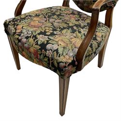 Pair of George III mahogany framed open armchairs, oval back and serpentine seat upholstered in fruit and foliage patterned fabric, shaped and moulded arms and arm supports, on square tapering moulded front supports 