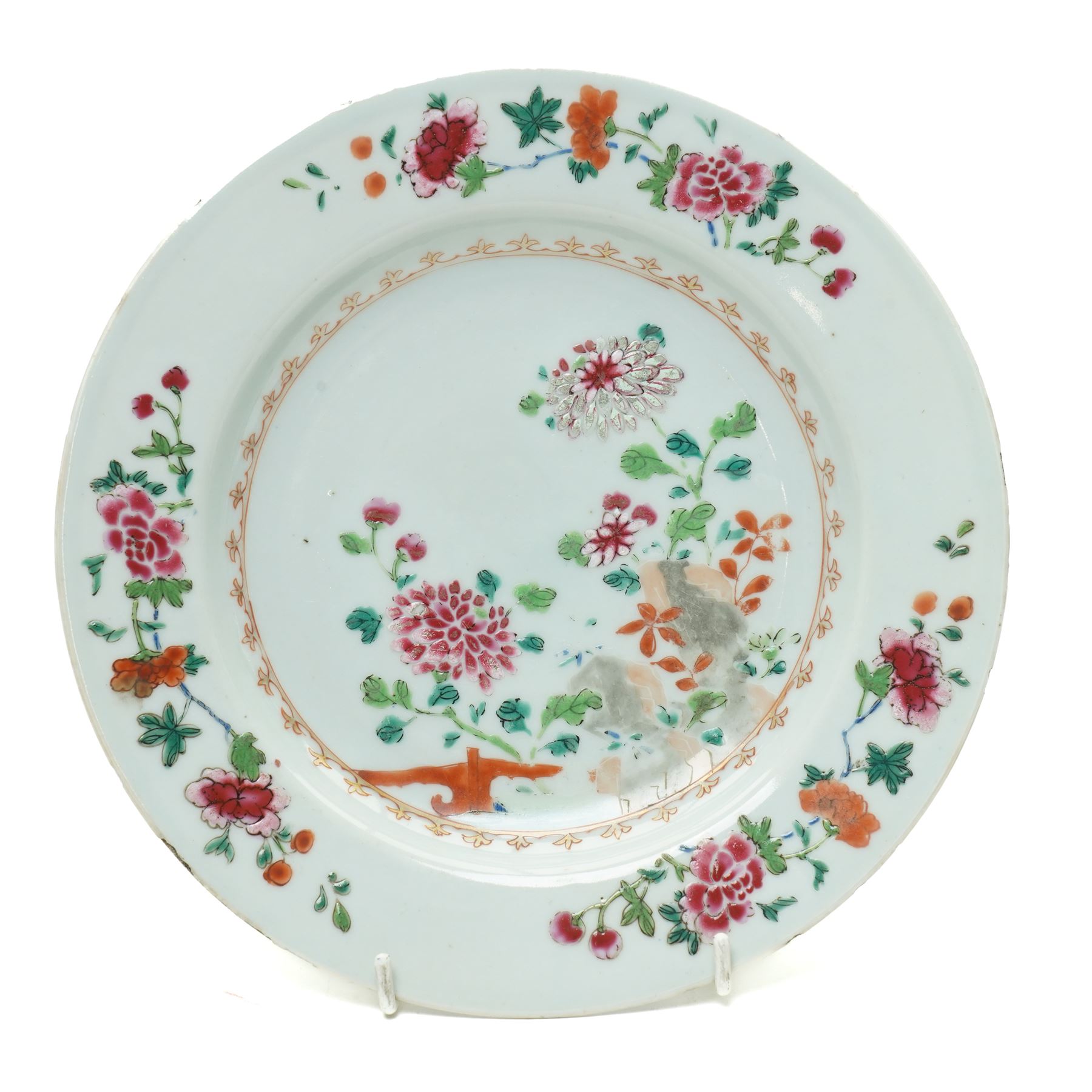 Pair of 18th century Chinese famille rose plates, painted profusely with flowers, D23cm; together with a Yixing teapot, painted with butterflies, H12cm (3)