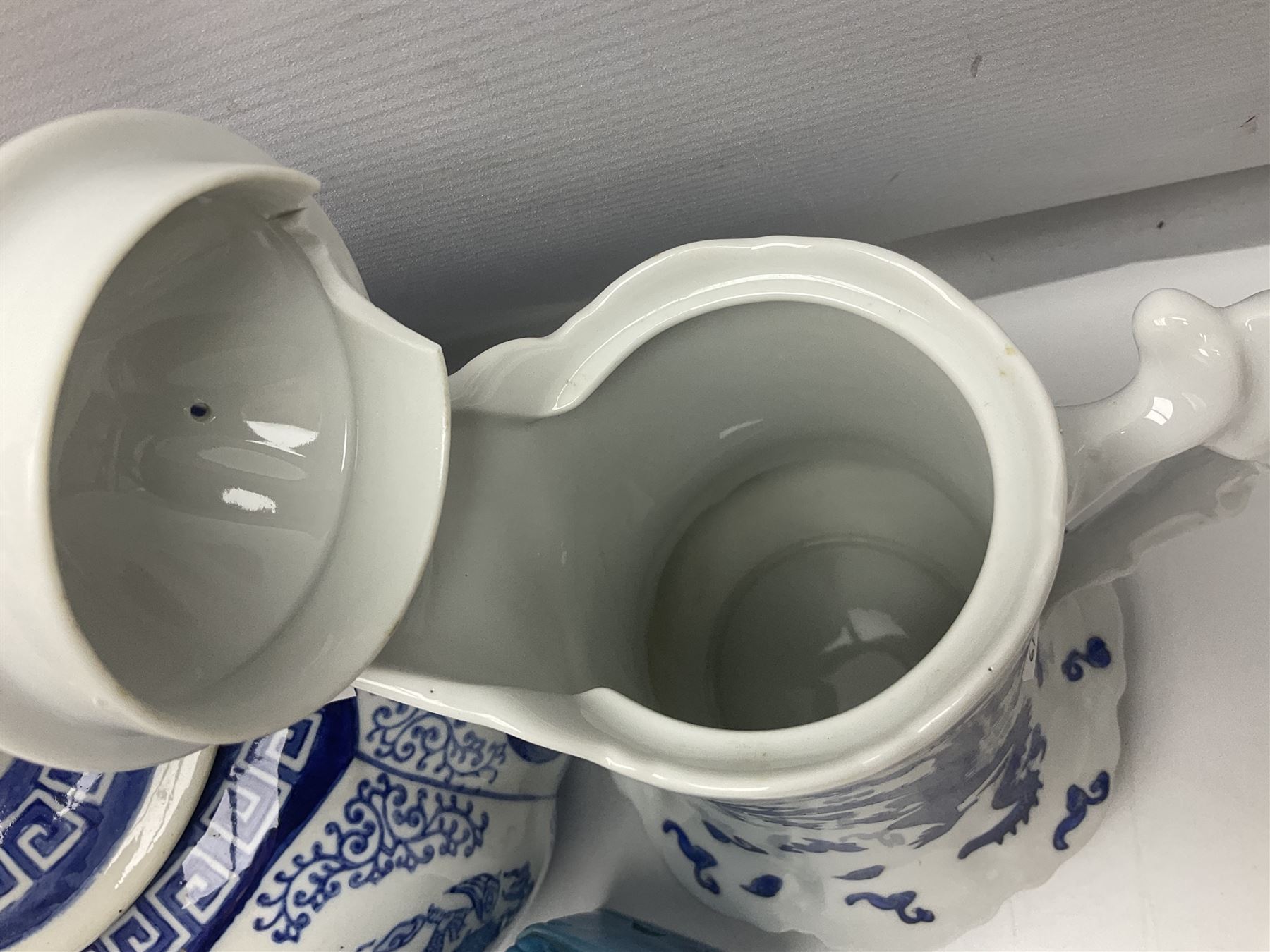 Chinese turquoise glazed foo dog, together with Yang Cheng iron red ginger jar, snuff bottle, and other oriental ceramics 