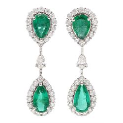 Pair of 18ct white gold pear shaped emerald and round brilliant cut diamond pendant stud earrings, the two clusters separated by a single pear shaped diamond, stamped, total emerald weight approx 2.15 carat, total diamond weight approx 1.15 carat