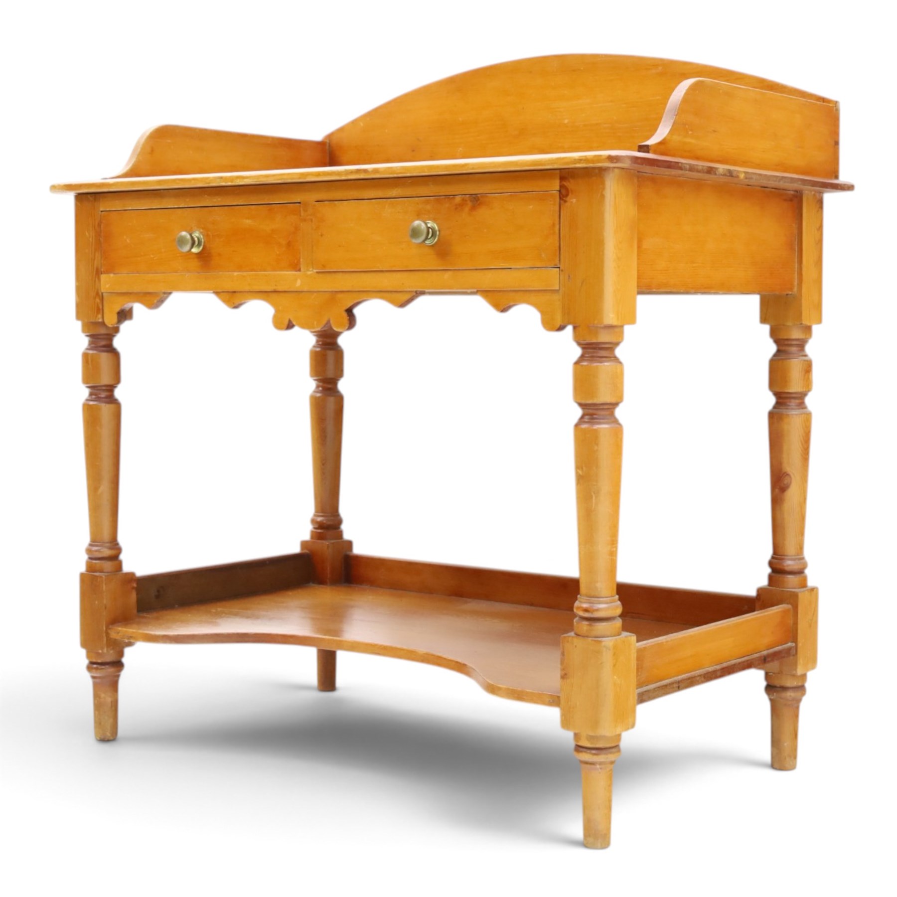 Victorian pine washstand, raised three quarter galleried top, fitted with two drawers, raised on turned supports united by a shaped full length under tier 