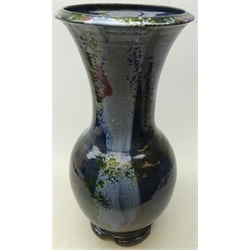  Eddie Curtis (British 1953-) large 1980s vase of baluster form with flared neck, with blue, copper and green glaze, impressed mark to base, H57cm   