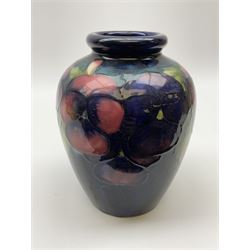 Moorcroft vase of ovoid form, decorated in Pansy pattern upon a dark blue ground, with impressed and painted marks beneath, H16.5cm. 