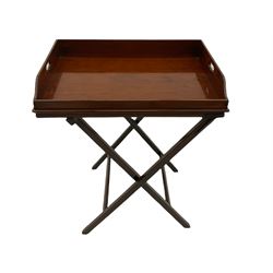Early 19th century mahogany butler's tray on folding stand, the tray with raised gallery pierced for handles, the folding base with square moulded supports and hinged top