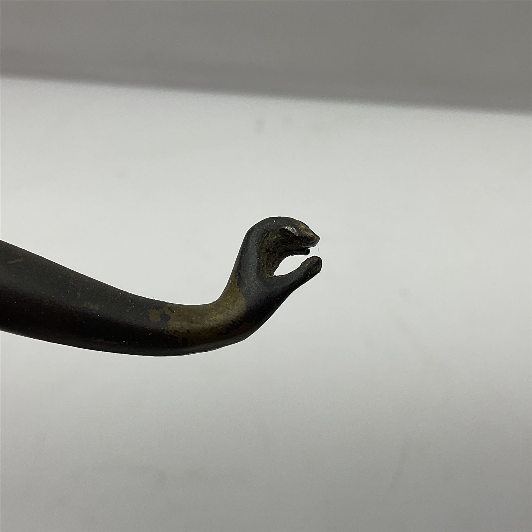 Bronze figure modelled as a nude woman with one arm raised a crescent moon upon her forehead, raised upon a circular stepped plinth, H36cm